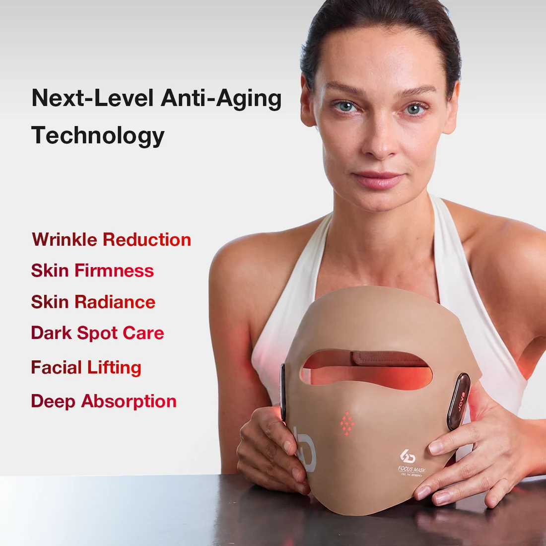 Person holding the JOVS 6D Laser & EMS Anti-Aging Mask